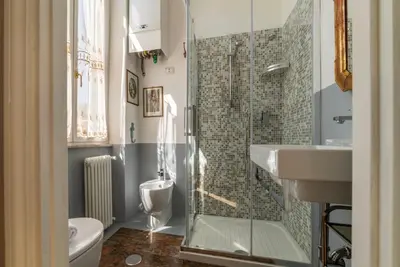a bathroom with a shower and a toilet and a sink at Sales - FromHometoRome in Rome