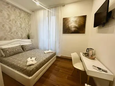 a bedroom with a bed with two pillows on it at Pantheon 15 in Rome