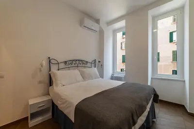 a bedroom with a bed and a window at Testaccio - FromHometoRome in Rome
