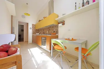 a kitchen with a table and some fruits on a table at At the Vatican Ottaviano 2 bedrooms 2 baths in Rome