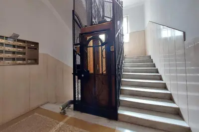 a door in a building with stairs and a stair case at At the Vatican Ottaviano 2 bedrooms 2 baths in Rome