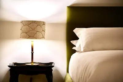 a bedroom with a bed and a lamp on a table at Casa Acerbo - Rome Navona Apartment in Rome