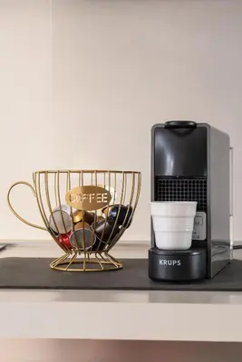 a coffee maker and a cup on a counter at alPigneto Apartment Rome in Rome