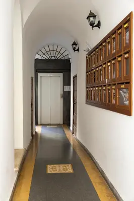 a hallway with a mat on the floor in a building at Views of the Coliseum in Rome