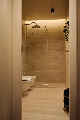 a bathroom with a shower and a white bath tub at Maison Luxury Pantheon in Rome