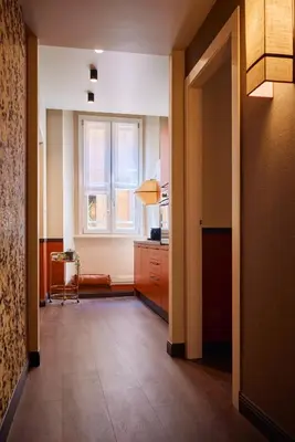 a hallway with a kitchen with a window at Maison Luxury Pantheon in Rome