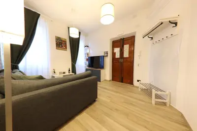 a living room with a couch and a television at Giulia's Vatican Apartment Saint Peter in Rome