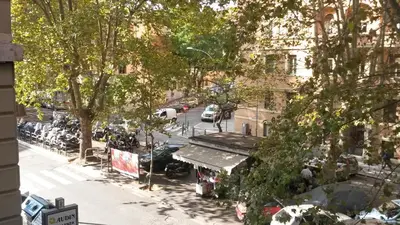 an overhead view of a city street with cars parked at LCH-Lateran Charming House in Rome