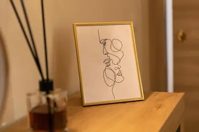 a framed drawing of a woman on a table at City Vibe Red Rose in Rome
