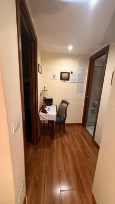 a dining room with a table and a chair at Casa Lory in Rome