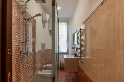 a bathroom with a toilet and a sink and a shower at CS Beautiful San Giovanni Apt in Rome