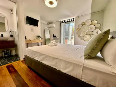 a bedroom with a large white bed with a sink at Casa Happya - Metro A - Central Rome in Rome