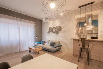 a living room with a couch and a table at BBB House Saint Peter in Rome