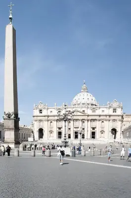 a large white building with a monument in front of it at Borgo Pio 51 Apartment Vatican in Rome
