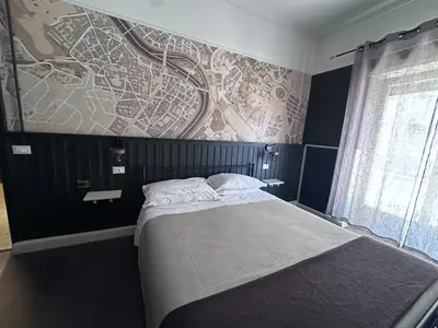 a bedroom with a round mirror on the wall at D-Place Cozy Comfy Relaxing House in Rome in Rome