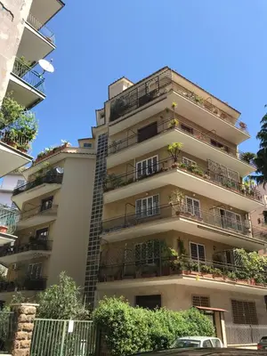 an apartment building with plants on the balconies at Appartamento con giardino tra San Pietro e Stadio Olimpico Roma in Rome