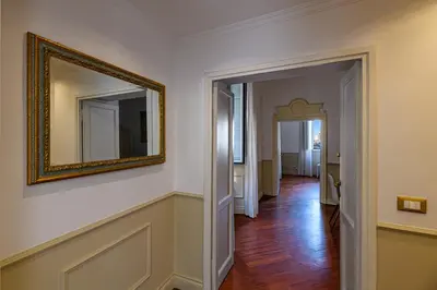 a hallway with a mirror on the wall and a hallway sidx sidx sidx at City Center Apartment - Pantheon in Rome