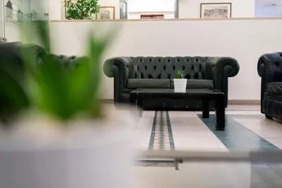 a living room with a couch and a coffee table at Casa per Ferie Santa Maria alle Fornaci in Rome