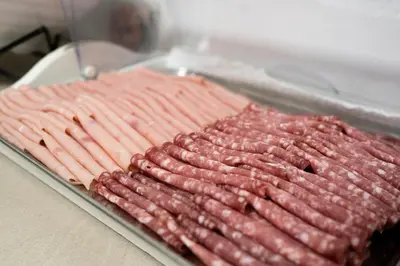 a row of hot dogs on a pan on a table at Casa per Ferie Santa Maria alle Fornaci in Rome