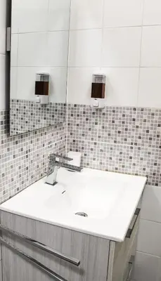 a bathroom with a white sink and a mirror at Silver Rose Guest House in Rome