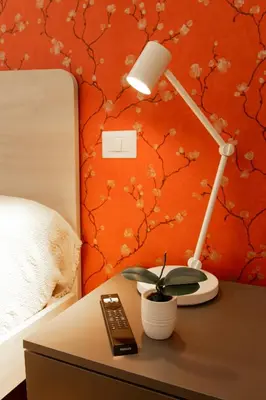 a desk with a lamp and a plant on it at Casa Caterina Holiday House - Bright Modern Apartment Near Trastevere in Rome