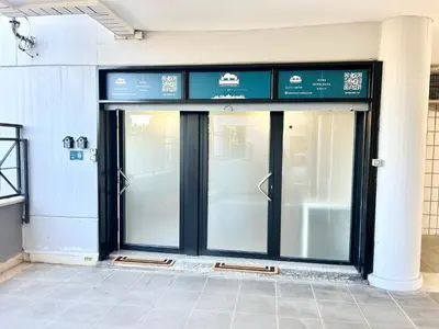 a store front with two glass doors in a building at Un Letto Ideale EUR - UN LETTO IDEALE in Rome