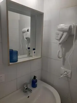 a bathroom with a sink and a mirror at Casa Roma Affittacamere in Rome