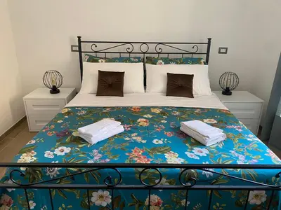 a kitchen and dining room with a table and chairs at Vatican flat family suite in Rome