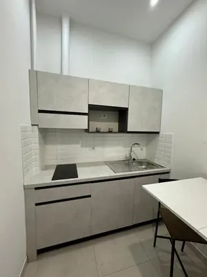 a kitchen with a sink and a counter top at Alba Nuova Suite in Rome