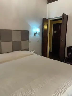 a bedroom with a large white bed in a room at Giglio apartment Navona in Rome