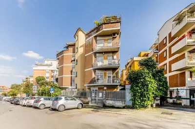 a row of cars parked in front of a building at Al 32C del Gianicolo in Rome