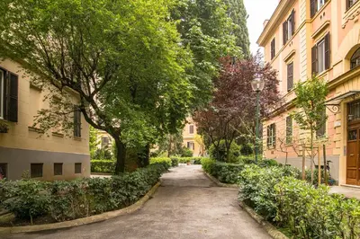 an alley in a city with trees and buildings at Esa apartment Flaminio in Rome