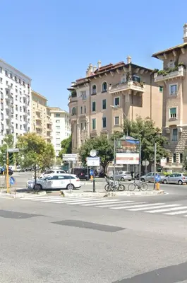a city street with cars and bikes on the street at Wow Rome Home in Rome