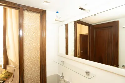 a bathroom with a sink and a mirror at Antuela Pantheon in Rome