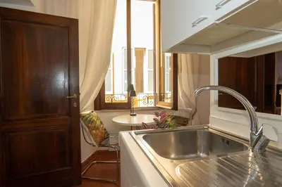 a kitchen with a sink and a window at Antuela Pantheon in Rome