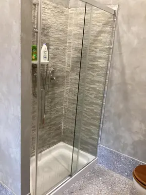 a shower with a glass door in a bathroom at casa galleria d'arte in Rome