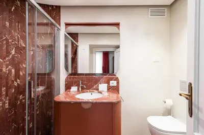 a bathroom with a sink and a shower at My Trevi Suite & Apartment in Rome