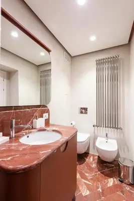 a bathroom with a sink and a toilet at My Trevi Suite & Apartment in Rome