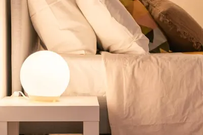 a bed with a table with a mirror on it at Porta Pia - cozy flat in Rome