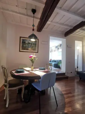 a dining room with a table and chairs and a couch at 