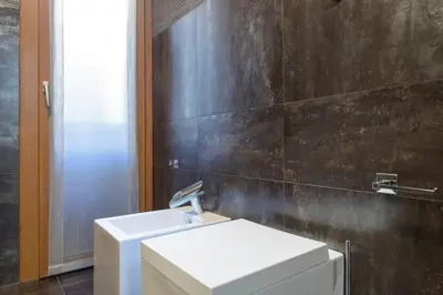 a bathroom with a white sink and a toilet at Rome Guest House Saint Peter in Rome