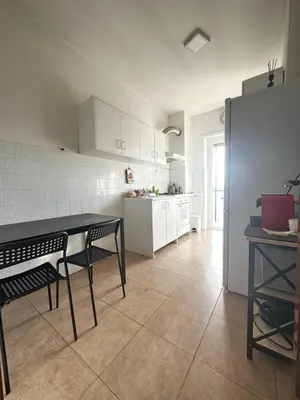 a bedroom with a bed and a large window at Holiday Roma prenestina in Rome