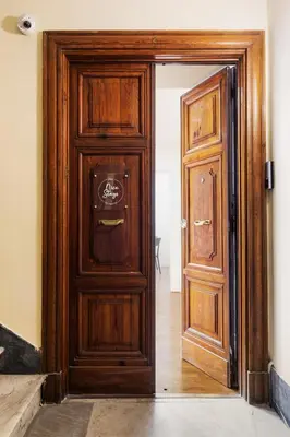 an open wooden door in a room at Rome Nice Stays in Rome
