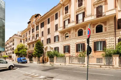 a building on a street with a car parked in front at Rome Nice Stays in Rome