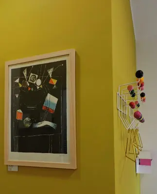 a picture of a painting on a wall with pins at Art Lab Residence in Rome