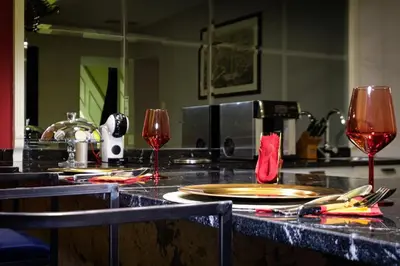 two glasses of red wine sitting on a counter at La Casa dei Sogni Roma in Rome