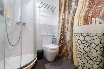 a bathroom with a toilet and a shower at La Casa dei Sogni Roma in Rome