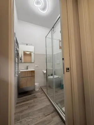 a bathroom with a sink and a shower at Rondinini Flam in Rome