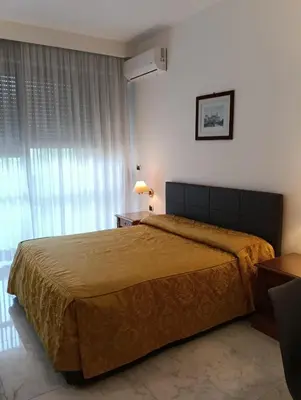 a bedroom with a large bed and a window at Monolocale Roma metro A Cornelia in Rome