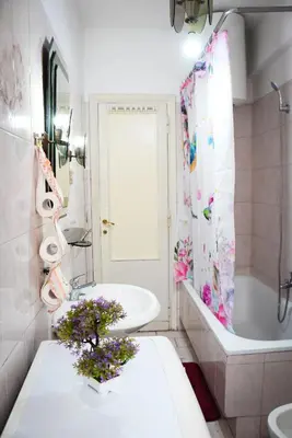 a bathroom with a sink and a toilet and a tub at A Casa di Lilly in Rome